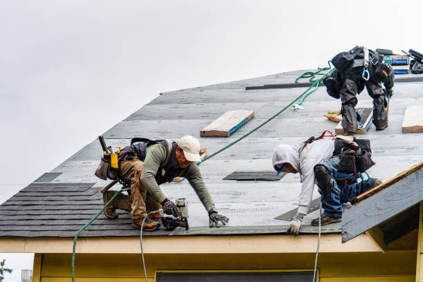 Professional Roofing technician working in Camp Sherman, OR